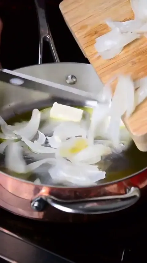 Delicious_Delilah frame at 00:14, Sizzling onions mirror Delilah’s feral energy—egg yolk suns drowning in murky brine