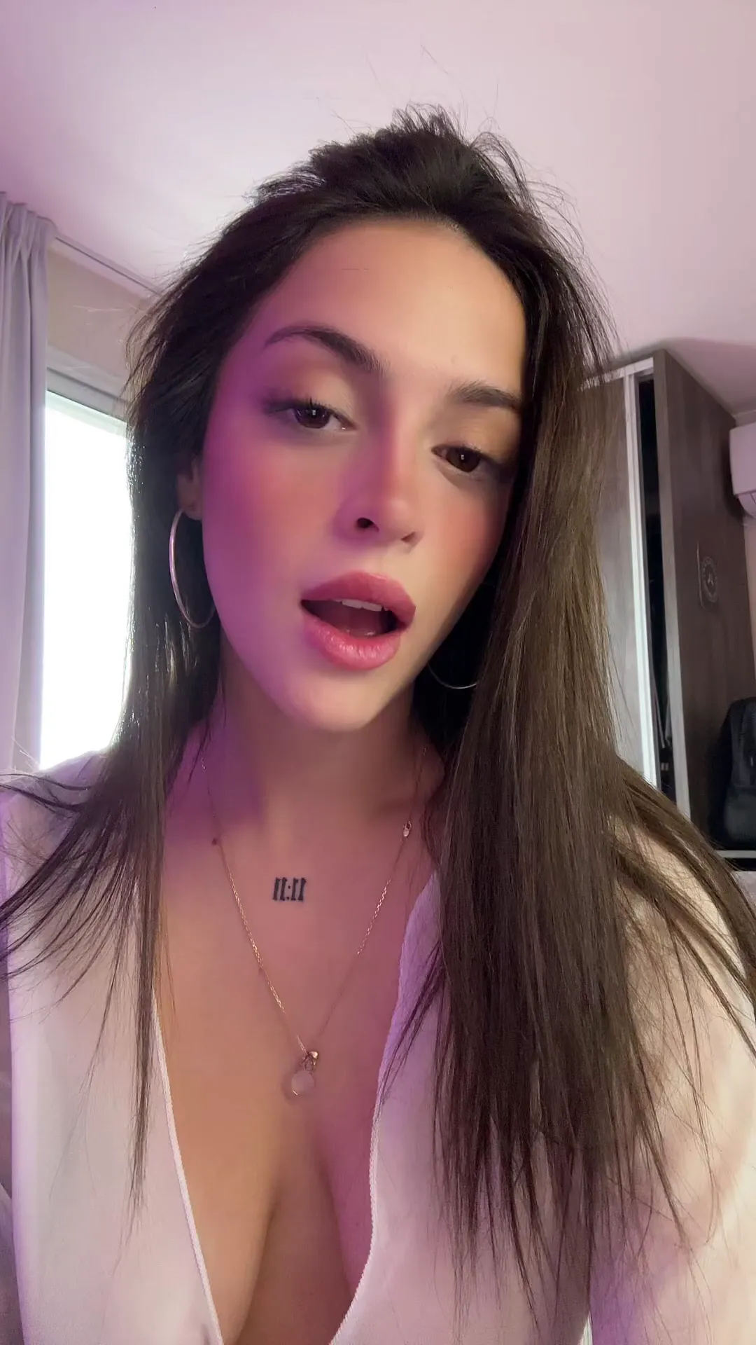 Hot_Bad_626 frame at 00:08, Purple haze seduction: Roman numeral 'III' claims territory above heaving fabric, parted lips whispering secrets to the wardrobe