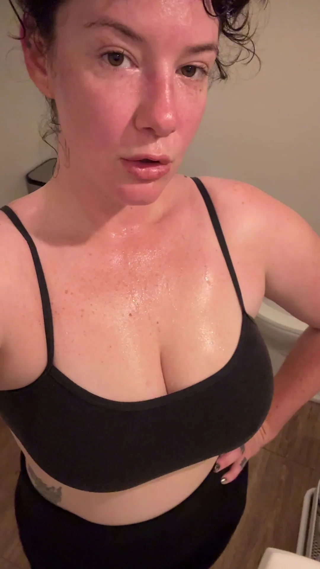 MAN_KEGELS frame at 00:01, MAN_KEGELS ignites the frame with smoldering confidence, her dark curls cascading over shoulders dotted with freckles like stardust