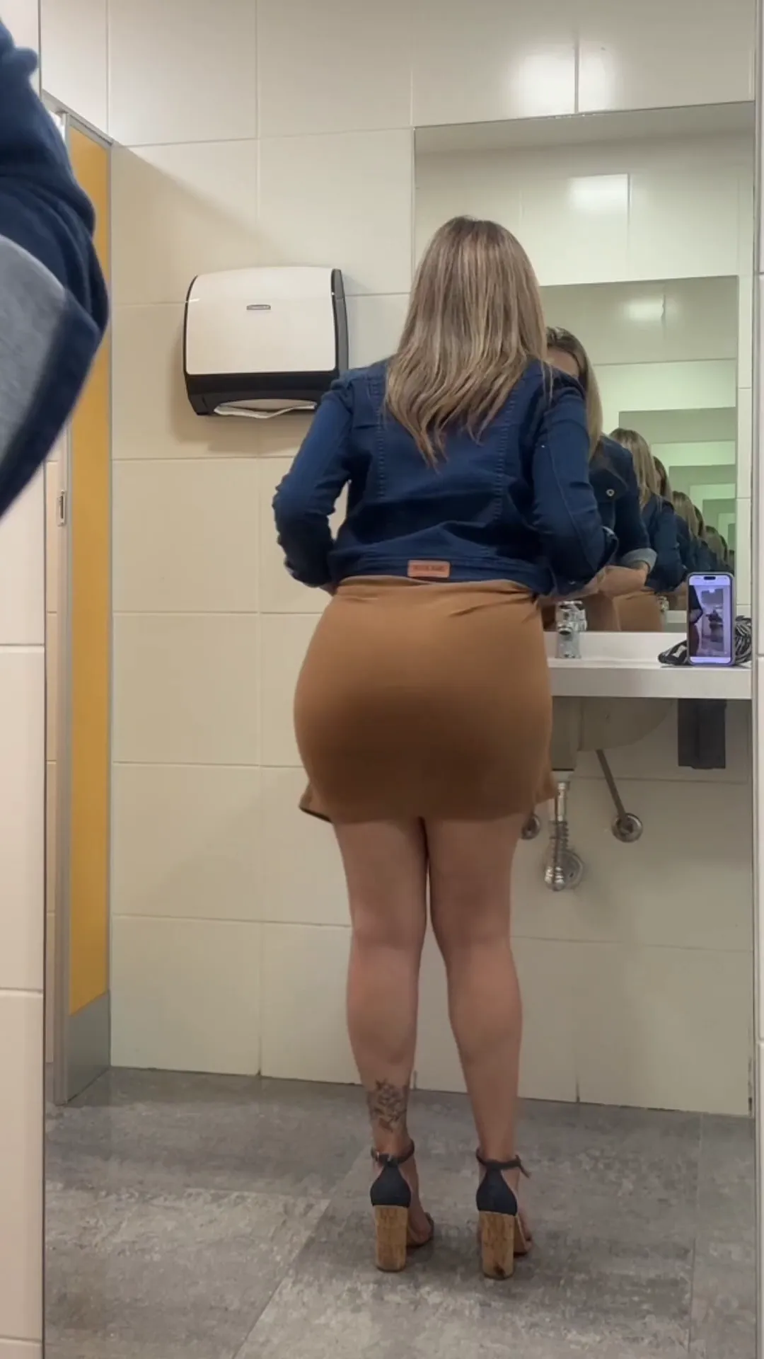 chloeof frame at 00:04, Chloeof turns a mundane restroom into her personal runway 🚽✨, the tan skirt gripping her gym-sculpted hips like a second skin